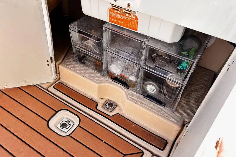  Yacht Photos Pics Storage compartment on a 2014 Cutwater C-28 boat with organized containers.