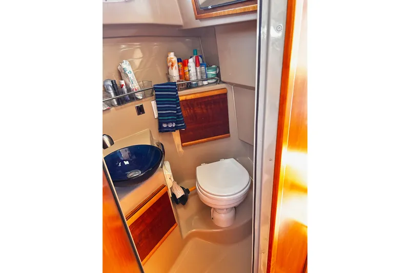  Yacht Photos Pics 2014 Cutwater C-28 boat bathroom with sink, toilet, and toiletries.