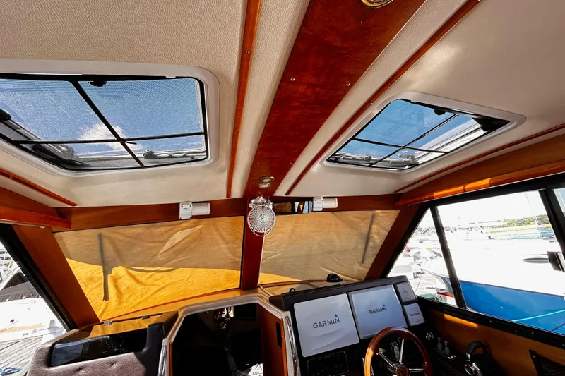 Yacht Photos Pics Interior view of 2014 Cutwater C-28 boat cockpit with Garmin navigation screens.