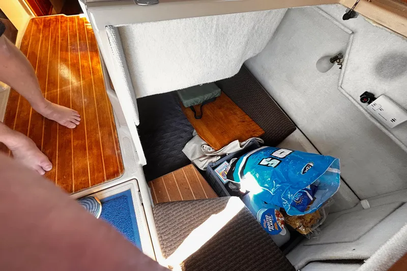  Yacht Photos Pics Interior of 2014 Cutwater C-28 boat with storage area and wooden flooring.