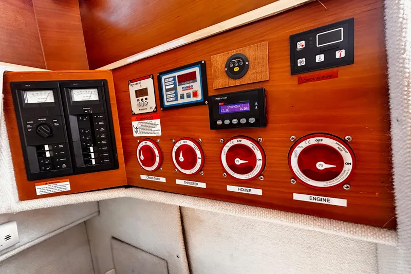  Yacht Photos Pics Electrical control panel of a 2014 Cutwater C-28 boat, featuring switches and gauges.
