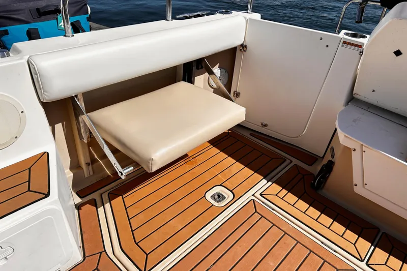  Yacht Photos Pics 2014 Cutwater C-28 boat interior with foldable seat and teak flooring.