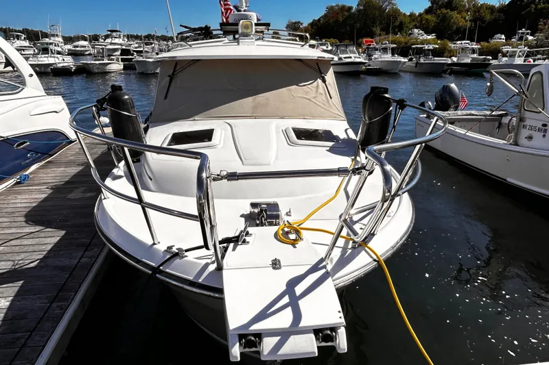  Yacht Photos Pics 2014 Cutwater C-28 boat docked at marina, surrounded by other vessels.
