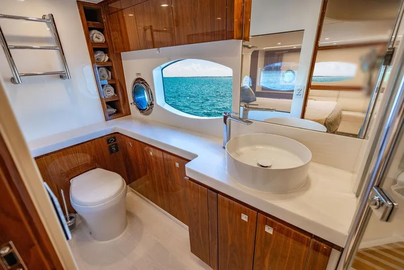 El Mar V Yacht Photos Pics Luxurious bathroom in 2022 Riviera 6000SY yacht with ocean view and modern amenities.