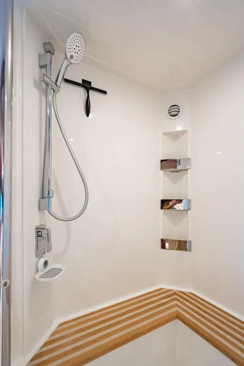 El Mar V Yacht Photos Pics 2022 Riviera 6000SY yacht shower with modern fixtures and sleek design.