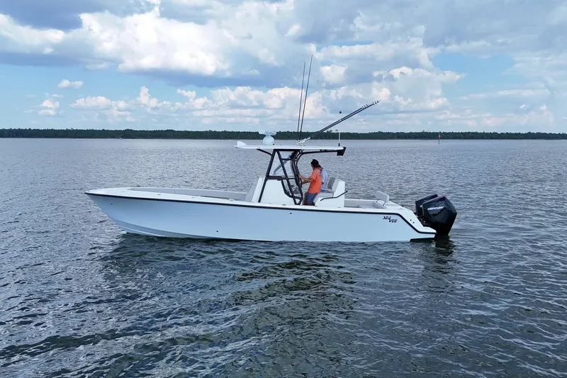  Yacht Photos Pics 2023 SeaVee 32 boat on calm water under a partly cloudy sky.