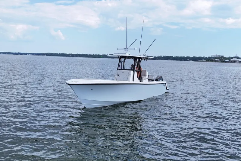  Yacht Photos Pics 2023 SeaVee 32 boat on calm water under a partly cloudy sky.