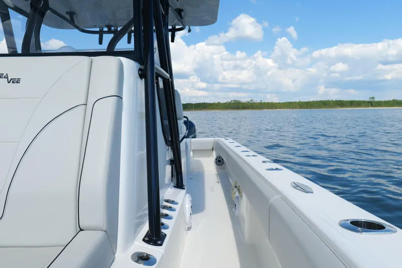  Yacht Photos Pics 2023 SeaVee 32 boat interior with ocean view and clear blue sky.