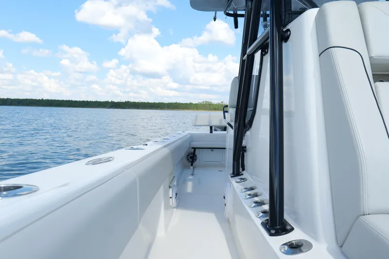  Yacht Photos Pics 2023 SeaVee 32 boat interior with sleek design on calm water.