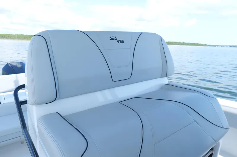  Yacht Photos Pics 2023 SeaVee 32 boat seat with sleek design on calm water.