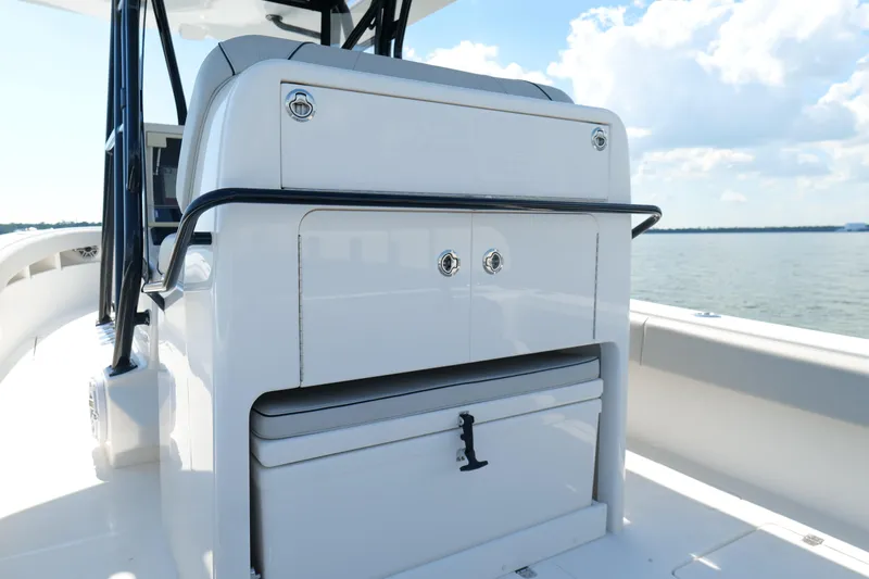  Yacht Photos Pics 2023 SeaVee 32 boat interior with storage compartment and ocean view.