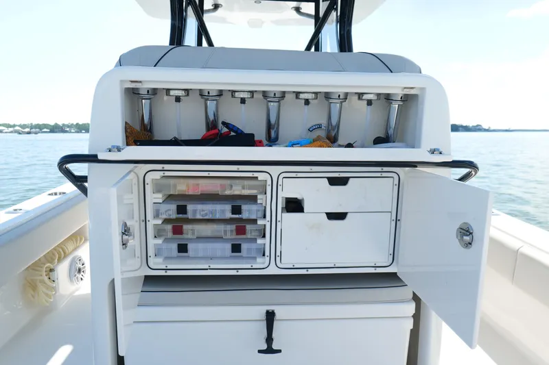  Yacht Photos Pics 2023 SeaVee 32 boat with open storage compartments and fishing rod holders.