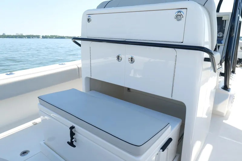  Yacht Photos Pics 2023 SeaVee 32 boat interior with storage compartments and cushioned seating.