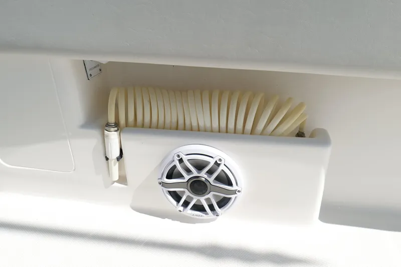  Yacht Photos Pics 2023 SeaVee 32 boat detail showing speaker and coiled hose storage.