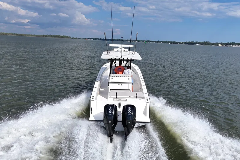  Yacht Photos Pics 2023 SeaVee 32 boat cruising on open water with twin engines.