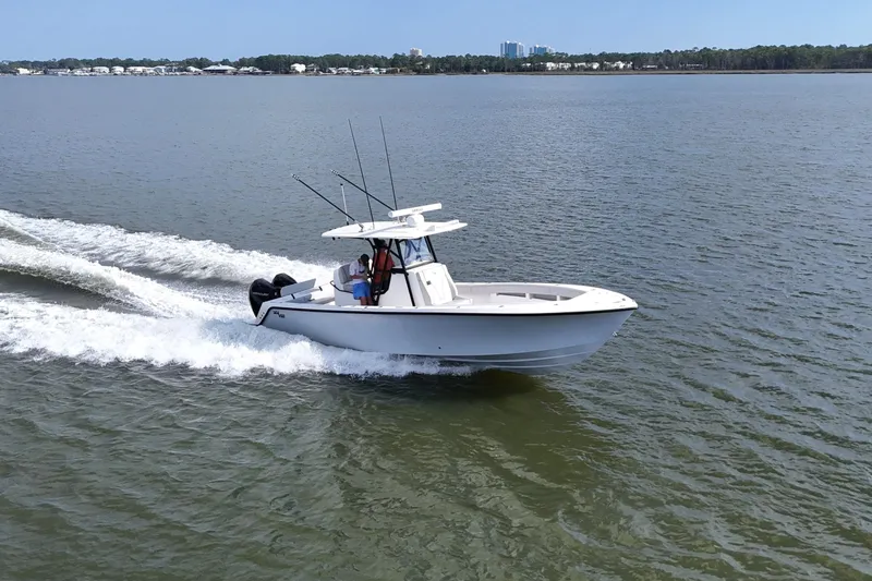  Yacht Photos Pics 2023 SeaVee 32 boat cruising on open water, showcasing sleek design and performance.