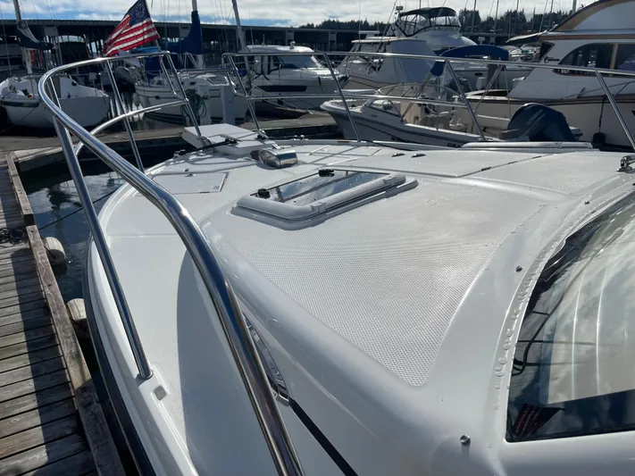  Yacht Photos Pics 2015 Cutwater 30 CB boat docked at marina with American flag.