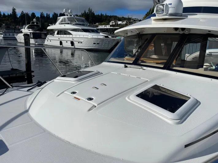 Yacht Photos Pics 2015 Cutwater 30 CB yacht docked, with other luxury boats in the background.