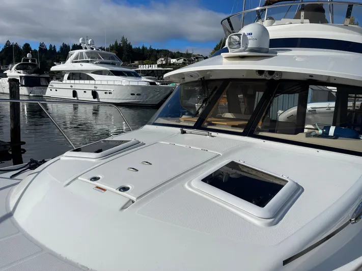  Yacht Photos Pics 2015 Cutwater 30 CB yacht docked in a marina with other boats.