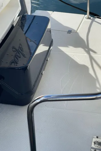  Yacht Photos Pics 2015 Cutwater 30 CB boat deck with railing and storage compartment.