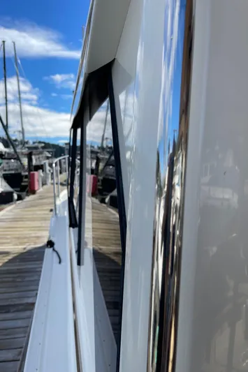  Yacht Photos Pics 2015 Cutwater 30 CB boat docked, reflecting marina view on a sunny day.