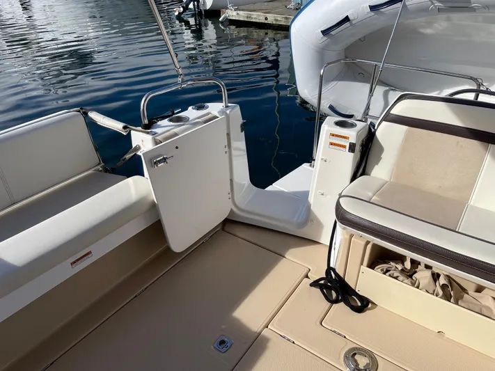  Yacht Photos Pics 2015 Cutwater 30 CB boat interior with seating and open deck area.