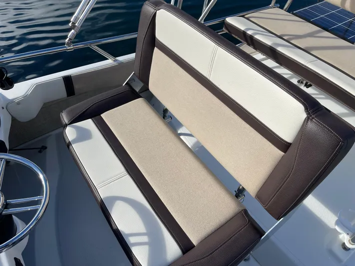  Yacht Photos Pics 2015 Cutwater 30 CB boat seating with beige and brown upholstery.