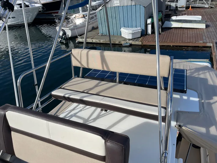  Yacht Photos Pics 2015 Cutwater 30 CB boat with seating area, docked at marina.