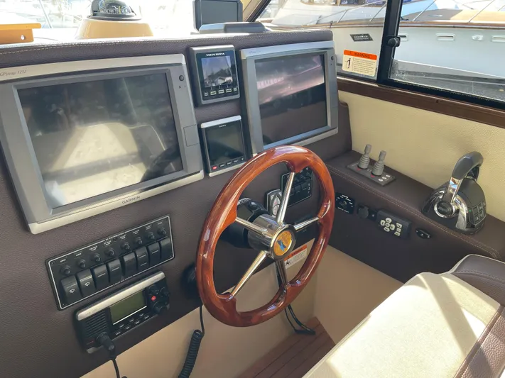  Yacht Photos Pics Dashboard of a 2015 Cutwater 30 CB boat with navigation screens and controls.
