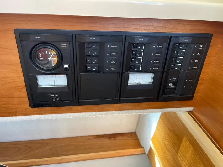  Yacht Photos Pics Control panel of a 2015 Cutwater 30 CB boat with gauges and switches.