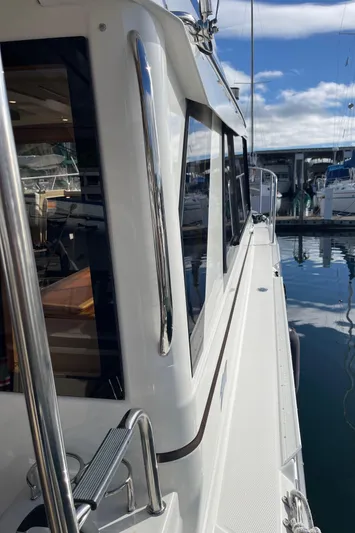  Yacht Photos Pics 2015 Cutwater 30 CB boat docked at marina, side view with clear skies.
