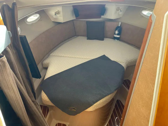  Yacht Photos Pics Cozy interior cabin of 2015 Cutwater 30 CB boat with comfortable bedding.