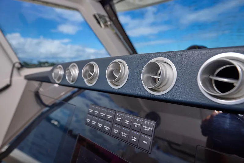 Tropical Moon Yacht Photos Pics Dashboard of 2022 Solace 41 CS boat with air vents and control panel.