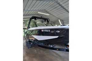 2023 Heyday H22 boat under a metal canopy, black and white design.