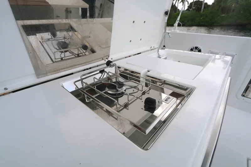  Yacht Photos Pics Outdoor kitchen on 2022 Beneteau FLYER 9 SPACE DECK boat with stainless steel stove.