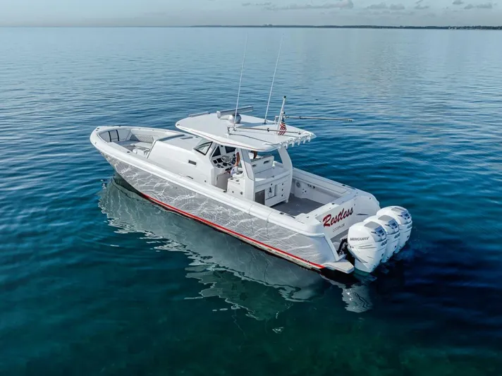  Yacht Photos Pics 2019 Intrepid 407 Panacea boat on calm blue water, featuring sleek design and powerful engines.