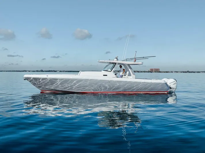  Yacht Photos Pics 2019 Intrepid 407 Panacea boat on calm water under clear sky.