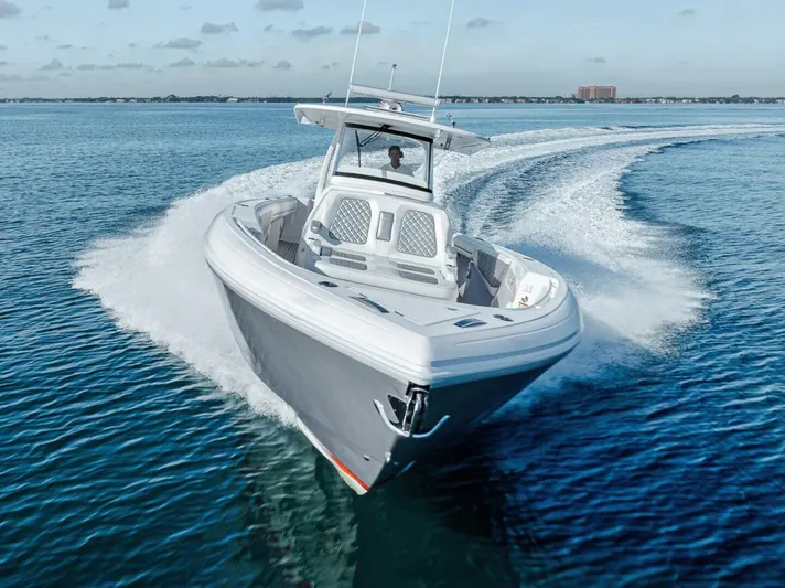  Yacht Photos Pics 2019 Intrepid 407 Panacea cruising on open water, showcasing sleek design and performance.