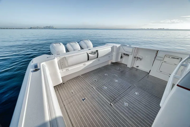  Yacht Photos Pics 2019 Intrepid 407 Panacea boat deck with triple engines on calm water.