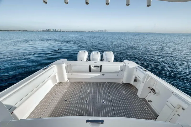  Yacht Photos Pics 2019 Intrepid 407 Panacea boat deck with triple engines on calm water.