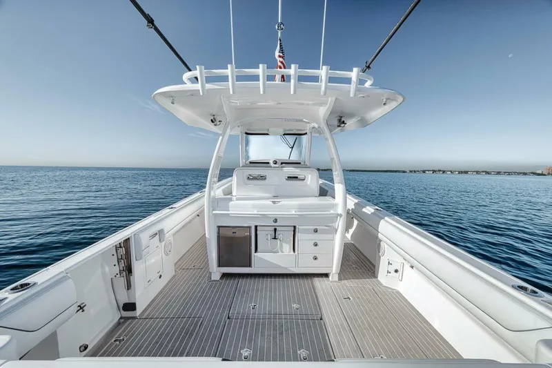  Yacht Photos Pics 2019 Intrepid 407 Panacea boat on calm ocean waters, showcasing spacious deck and sleek design.