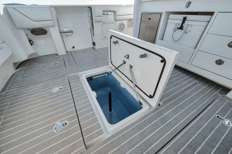  Yacht Photos Pics 2019 Intrepid 407 Panacea boat deck with open storage compartment.