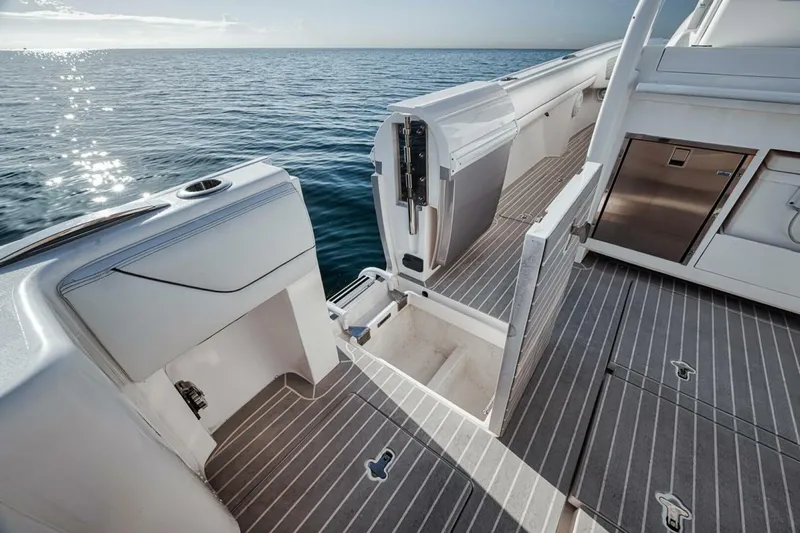  Yacht Photos Pics 2019 Intrepid 407 Panacea boat deck with open storage, ocean view.