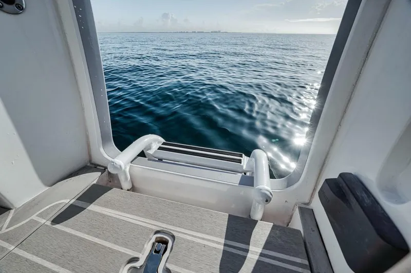  Yacht Photos Pics 2019 Intrepid 407 Panacea boat with swim platform overlooking ocean.