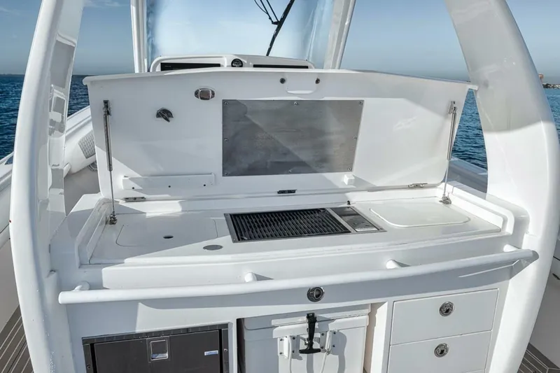  Yacht Photos Pics 2019 Intrepid 407 Panacea boat with sleek white outdoor kitchen setup.
