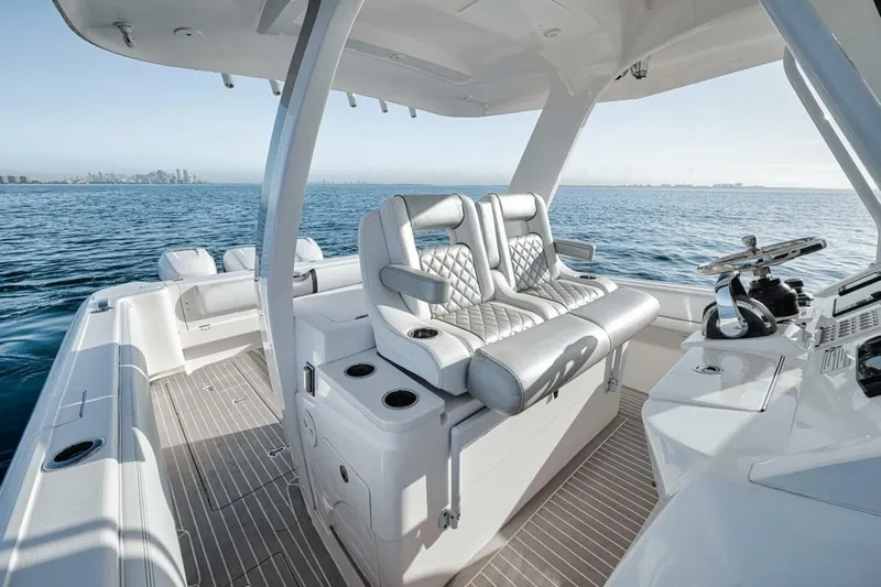  Yacht Photos Pics Luxurious 2019 Intrepid 407 Panacea boat interior with plush seating on open water.