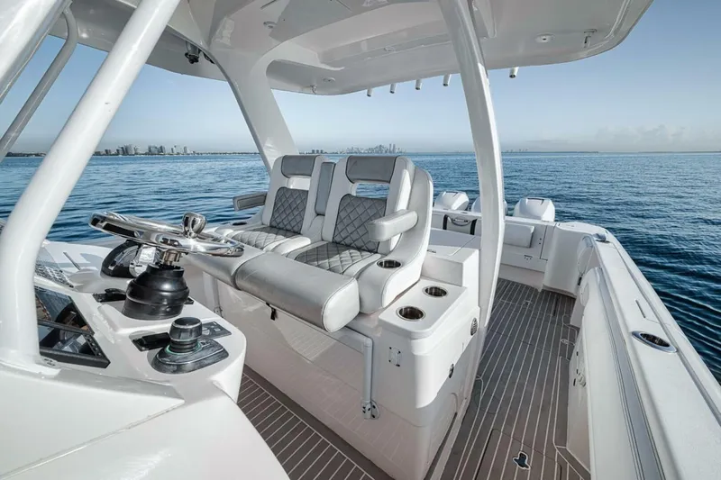  Yacht Photos Pics 2019 Intrepid 407 Panacea boat interior with modern helm and seating on open water.