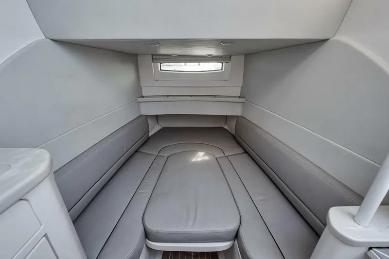  Yacht Photos Pics 2019 Intrepid 407 Panacea cabin interior with gray seating and window.