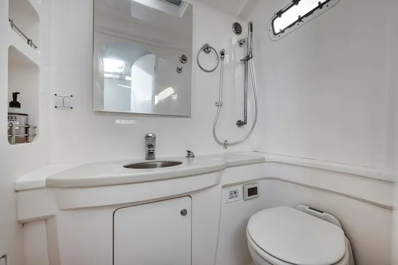  Yacht Photos Pics 2019 Intrepid 407 Panacea boat bathroom with modern fixtures and sleek design.