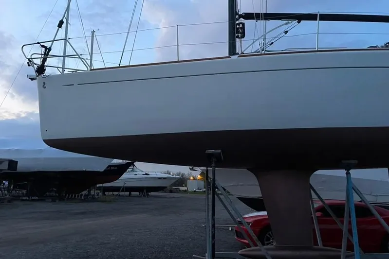 Targa Yacht Photos Pics 2008 Beneteau First 10R sailboat on stands in a boatyard at dusk.
